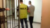 policjant z zatrzymanym